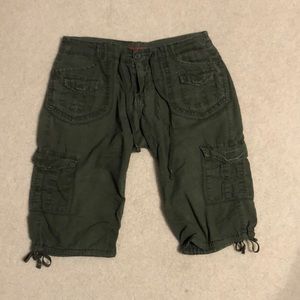 One pair of cargo green shorts, size 5. Has six pockets.